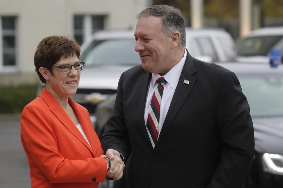 German Defense Minister Annegret Kramp-Karrenbauer, left, welcomes United States Secretary of State Mike Pompeo for a meeting at the defence ministry in Berlin, Germany, Friday, Nov. 8, 2019. (AP Photo/Markus Schreiber)