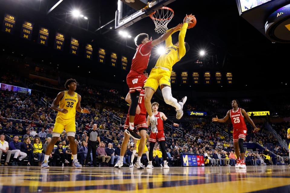 Michigan Wolverines guard Jaelin Llewellyn shoots on Wisconsin Badgers guard Chucky Hepburn in the first half at Crisler Center on Wednesday, Feb. 7, 2024, in Ann Arbor, Michigan.