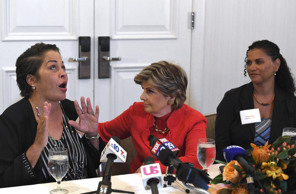 FILE - In this Sept. 23, 2018 file photo, attorney, Gloria Allred, center, along with her clients, Chelan Lasha, left, and Lise-Lotte Lublin, right, both of whom have accused Bill Cosby of sexual assault, talk to the media during a press conference at the Le Meridien Hotel in Philadelphia, Pa. Cosby has spent more than two years in prison since he was convicted of sexual assault in the first celebrity trial of the #MeToo era. Now the Pennsylvania Supreme Court is set to hear his appeal of the conviction on Tuesday, Dec. 1, 2020. The arguments will focus on the trial judge's decision to let five other accusers testify for the prosecution. (Jose F. Moreno/The Philadelphia Inquirer via AP, File)