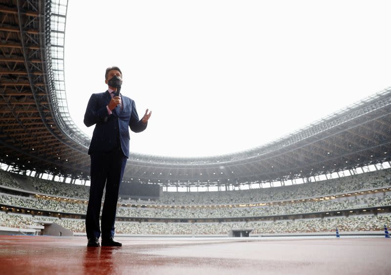 World Athletics President Sebastian Coe wearing a protective face mask speaks to media as he inspects at the National Stadium, amid the coronavirus disease (COVID-19) outbreak in Tokyo