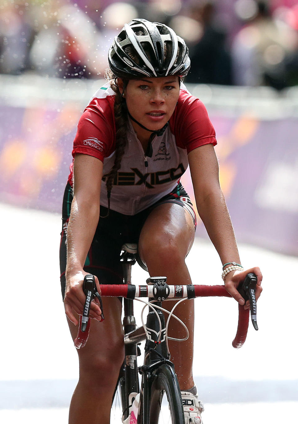 LONDON, ENGLAND - JULY 29: Ingrid Drexel of Mexico crosses the finish line during the Women's Road Race Road Cycling on day two of the London 2012 Olympic Games on July 29, 2012 in London, England (Photo by Bryn Lennon/Getty Images)