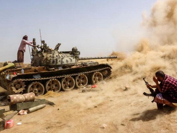 A tank belonging to forces loyal to Yemen’s southern separatists fires while on the frontline of clashes with pro-government forces for control of Zinjibar, the capital of the southern Abyan province (AFP via Getty)