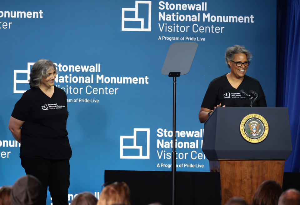 Diana Rodriguez and Ann Marie Gothard speak during a celebration for the Stonewall National Monument Visitor Center