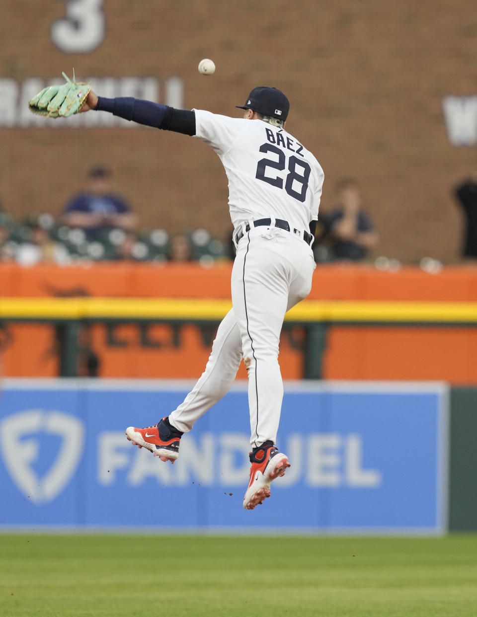 Detroit Tigers shortstop Javier Baez misses the single hit by Pittsburgh Pirates' Ke'Bryan Hayes during the sixth inning of a baseball game, Tuesday, May 16, 2023, in Detroit. (AP Photo/Carlos Osorio)