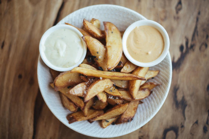 Fries and sauces on a plate