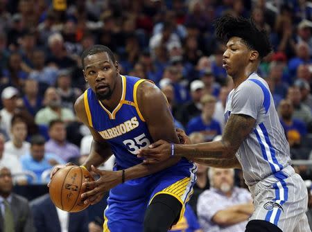 Jan 22, 2017; Orlando, FL, USA; Golden State Warriors forward Kevin Durant (35) moves to the basket as Orlando Magic guard Elfrid Payton (4) defends during the second quarter at Amway Center. Mandatory Credit: Kim Klement-USA TODAY Sports