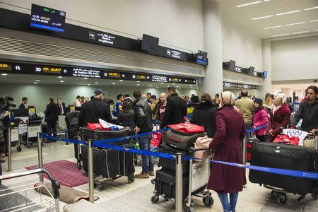 Syrian refugees check their baggage at the beginning of an airlift to Canada, at the Beirut International airport December 10, 2015 in a photo provided by the Canadian military. REUTERS/Corporal Darcy Lefebvre/Canadian Forces Combat Camera/Handout via Reuters