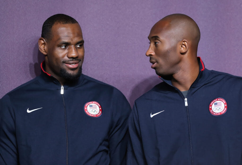 LeBron James (L) and Kobe Bryant (R) look on during a basketball press conference ahead of the London 2012 Olympics on July 27, 2012 in London, England. (Photo by Jeff Gross/Getty Images)