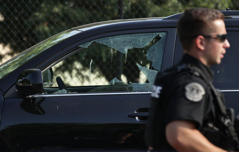 A broken window on a vehicle is seen outside&nbsp;Eugene Simpson Stadium Park, where the shooting took place. (Photo: Alex Wong via Getty Images)