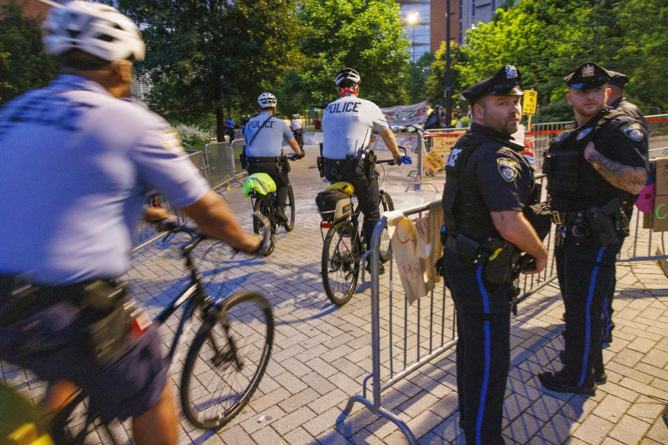 Police stand by as protestors prepare to leave a pro-Palestinian encampment at Drexel University early Thursday, May 23, 2004 in Philadelphia. (Alejandro A. Alvarez/The Philadelphia Inquirer via AP)