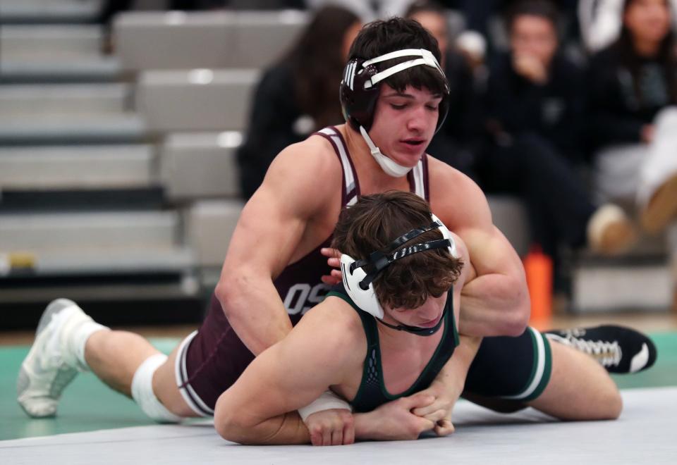 Tyler Caricati from Yorktown and Anthony Lofaro from Ossining wrestle in the 170-pound weight class during the Section 1 Division I Dual Meet Tournament at Yorktown High School Dec. 21, 2023. Lofaro won the match.