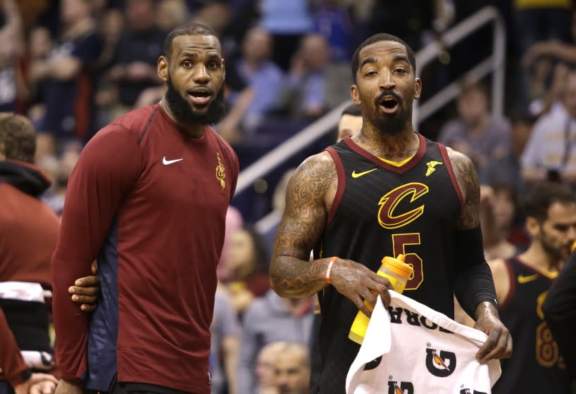 Cleveland Cavaliers forward LeBron James and JR Smith (5) in the second half.