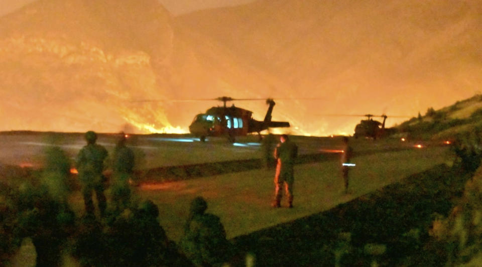 In this photo provided by the Turkish Ministry of Defence on Wednesday, June 17, 2020, Turkish troops in action against Kurdish militants in northern Iraq. Turkey says it has airlifted troops for a cross-border ground operation against Turkey's Kurdish rebels in northern Iraq. The Defense Ministry in Ankara says the airborne offensive in Iraq’s border region of Haftanin was launched on Wednesday following intense artillery fire into the area. The ministry says commando forces are being supported by warplanes, attack helicopters, artillery and armed and unarmed drones. (Turkish Ministry of Defence via AP)