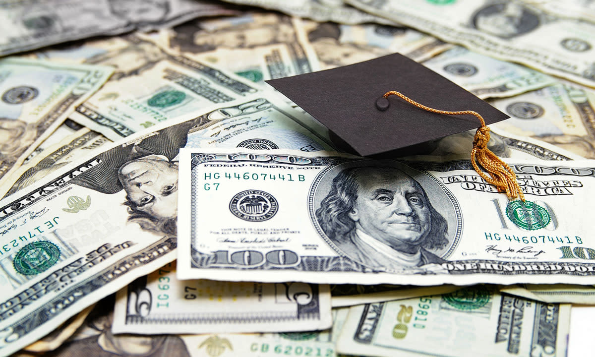 This is a photo of money with a graduation cap on top.