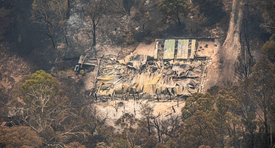 An aerial view of a property damaged by East Gippsland fires in Sarsfield.