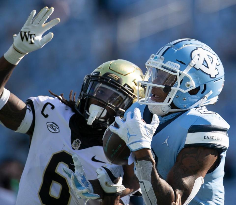 Wake Forest defense back Ja’Sir Taylor (6) defends North Carolina’s Dyami Brown (2) in the second quarter at Kenan Stadium on Saturday, November 14, 2020 in Chapel Hill, N.C. Taylor took the ball away from Brown and was credited with an interception.