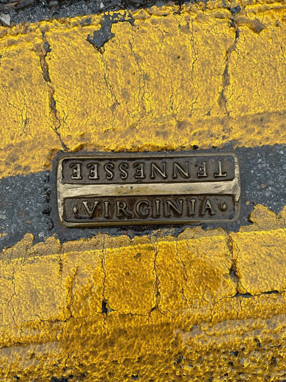 This marker in the middle of Bristol's State Street indicates which side of the road is in Virginia and which is in Tennessee. The city straddles the state line.