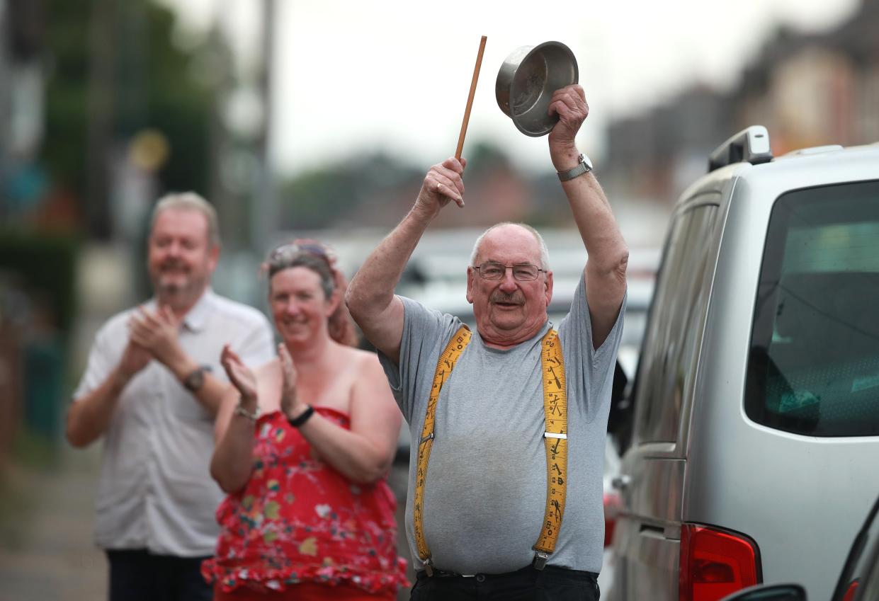 <p>Local residents applaud in support of NHS and other key workers on May 21, 2020 in Northampton</p> (Getty)