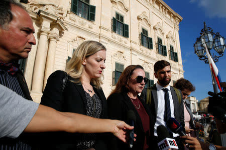 Rebecca Vincent of Reporters Without Borders, Courtney Radsch of the Committee to Protect Journalists, and other delegations members from PEN International and the European Centre for Press and Media Freedom talk to journalists after a meeting with Maltese Prime Minister Joseph Muscat about the assassination of anti-corruption journalist Daphne Caruana Galizia, outside the Auberge de Castille in Valletta, Malta October 15, 2018. REUTERS/Darrin Zammit Lupi