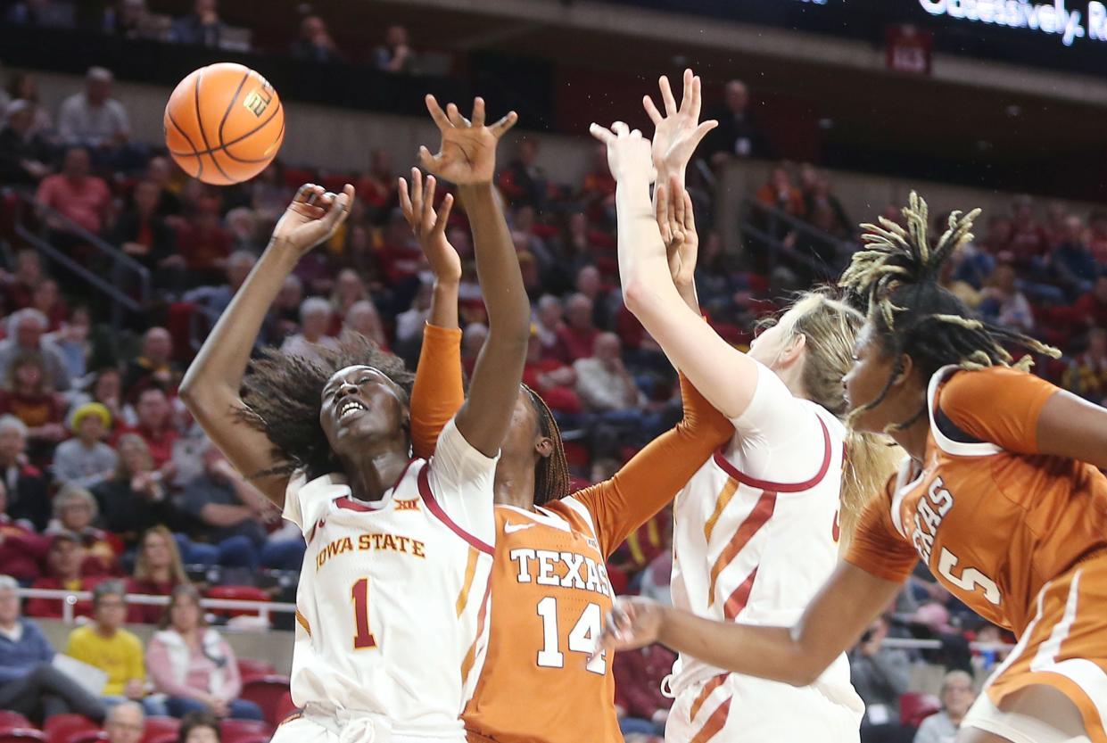 Iowa State's Nyamer Diew, left, battles Texas' Amina Muhammad for a rebound in Ames, Iowa, last February. Diew will be one of the few familiar faces when the two teams meet for the first time this season Saturday at Moody Center.