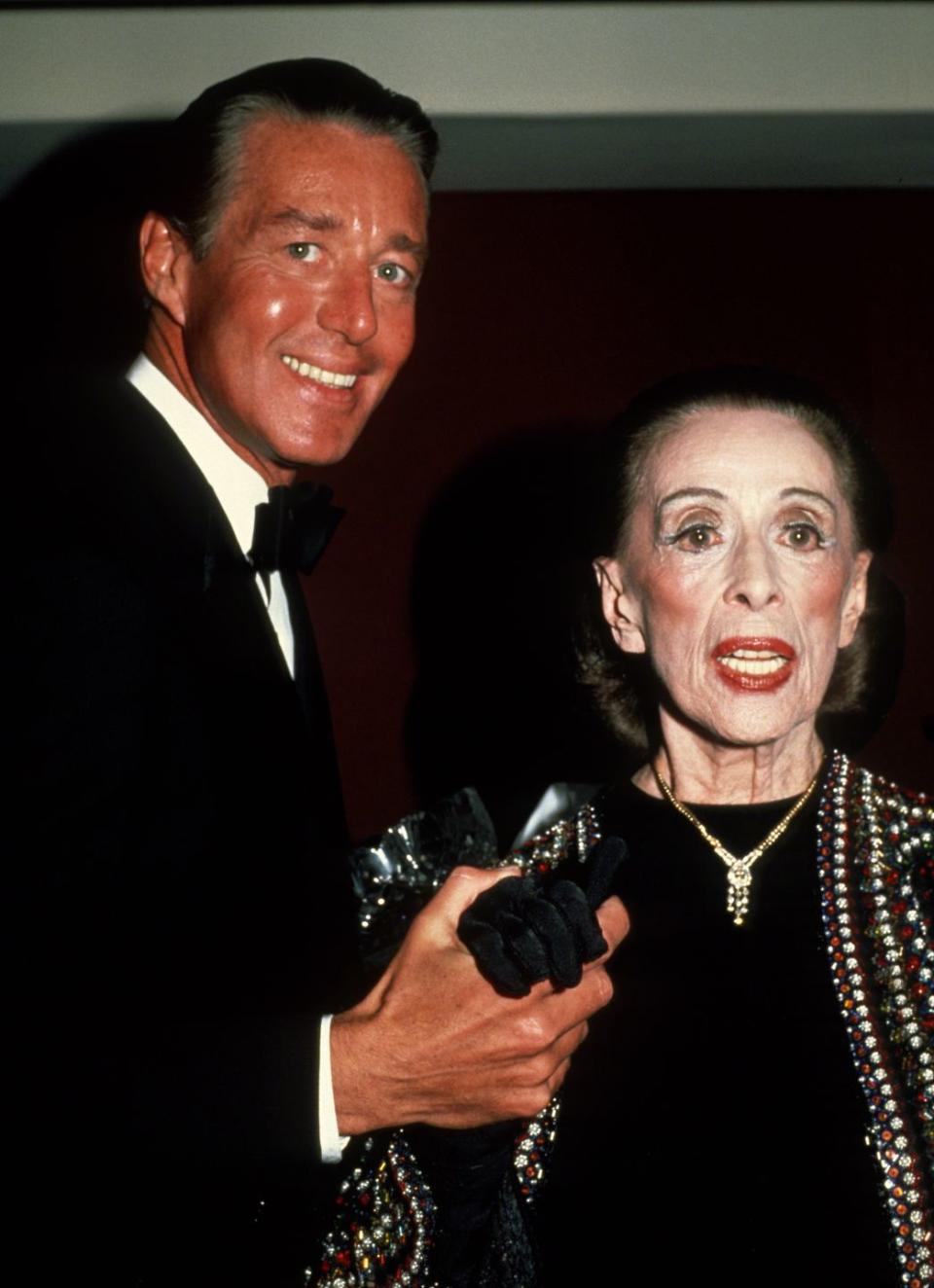 <p>Halston and iconic dancer Martha Graham are pictured here at an event. The pair collaborated on costumes for Graham's dance productions. </p>