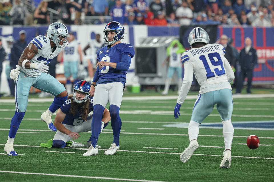 Sep 10, 2023; East Rutherford, New Jersey, USA; Dallas Cowboys safety <a class="link " href="https://sports.yahoo.com/nfl/players/34595" data-i13n="sec:content-canvas;subsec:anchor_text;elm:context_link" data-ylk="slk:Juanyeh Thomas;sec:content-canvas;subsec:anchor_text;elm:context_link;itc:0">Juanyeh Thomas</a> (30) blocks a field goal attempt by New York Giants place kicker <a class="link " href="https://sports.yahoo.com/nfl/players/9526" data-i13n="sec:content-canvas;subsec:anchor_text;elm:context_link" data-ylk="slk:Graham Gano;sec:content-canvas;subsec:anchor_text;elm:context_link;itc:0">Graham Gano</a> (9) as cornerback Noah Igbinoghene (19) recovers the block during the first quarter at MetLife Stadium. Mandatory Credit: Vincent Carchietta-USA TODAY Sports