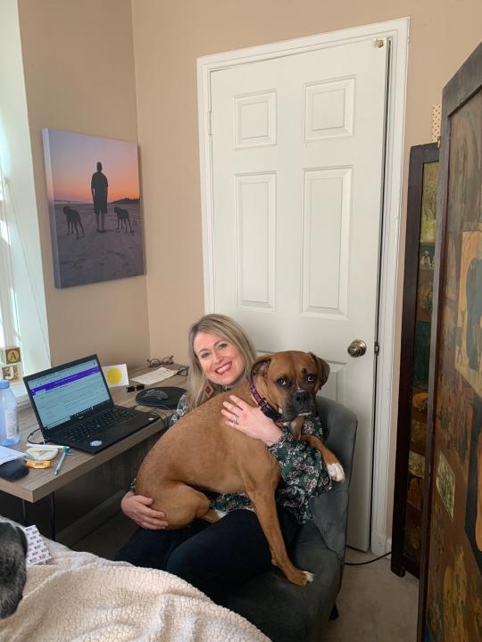 My home office and office assistant, Greta! Greta is one of two boxers I've adopted.