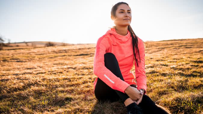 Portrait of a beautiful sporty woman enjoying the view after workout.