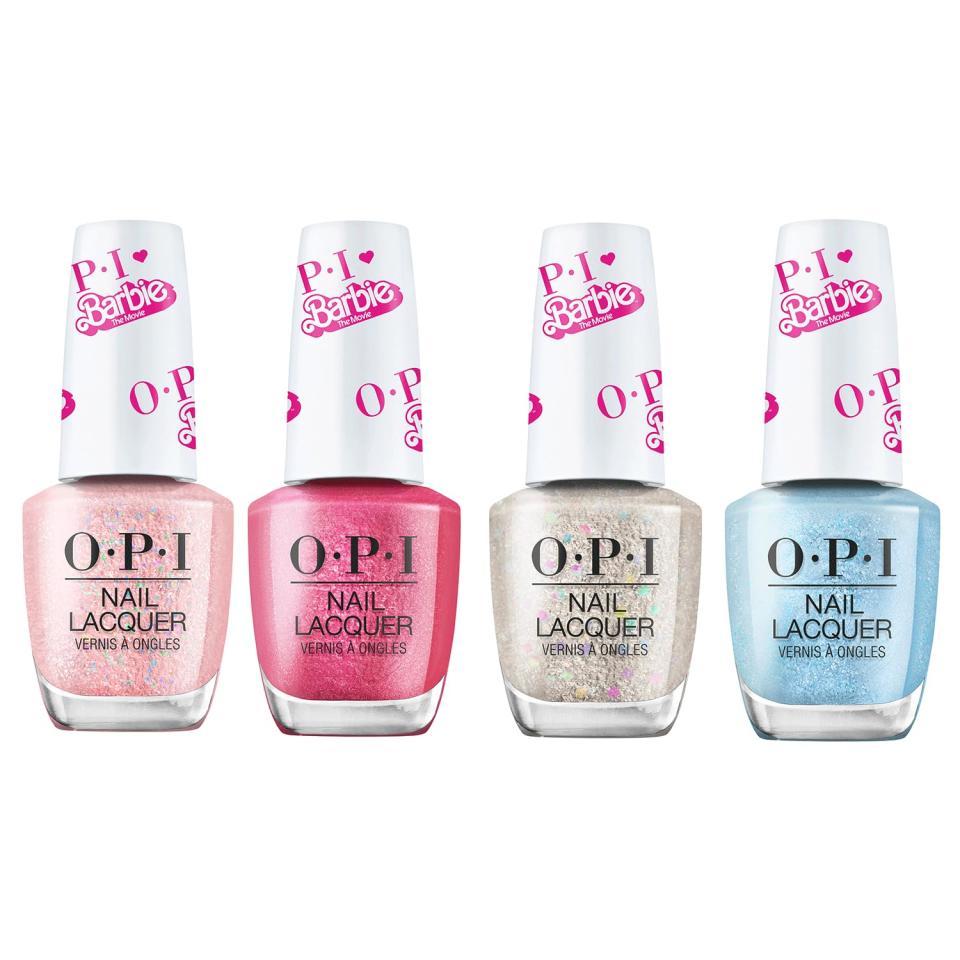 four bottle of pink, silver and blue nail polish