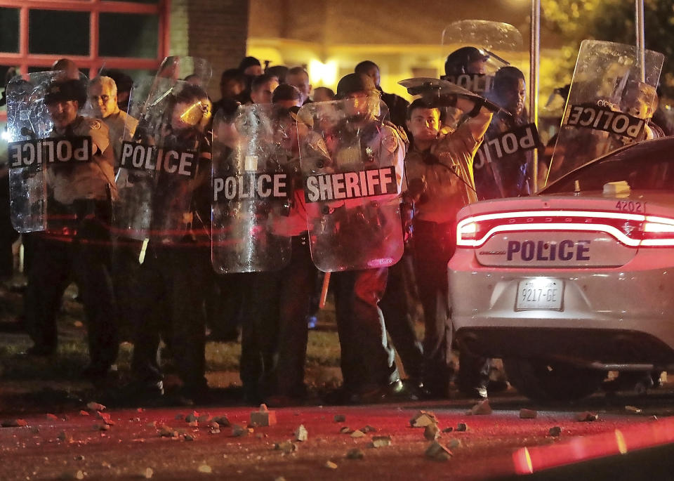 Shelby County Sheriff's deputies brace against the crowd as protesters take to the streets of the Frayser community in anger against the shooting a youth identified by family members as Brandon Webber by U.S. Marshals earlier in the evening, Wednesday, June 12, 2019, in Memphis, Tenn. (Photo: Jim Weber/Daily Memphian via AP)