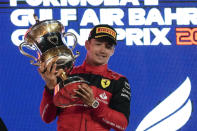 Ferrari driver Charles Leclerc of Monaco celebrates after he won the Formula One Bahrain Grand Prix it in Sakhir, Bahrain, Sunday, March 20, 2022. (AP Photo/Hassan Ammar)