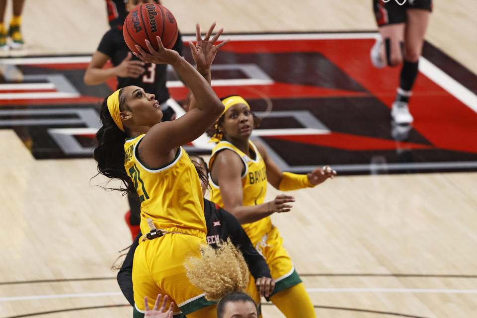 Baylor's DiJonai Carrington (21) shoots during the second half of the team's NCAA college basketball game against Texas Tech, Wednesday, Feb. 10, 2021, in Lubbock, Texas. (AP Photo/Brad Tollefson)