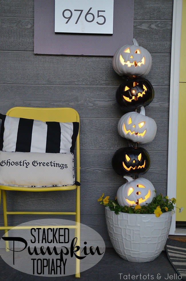 <p>Stack black and white Jack-o-Lanterns for an eye-catching twist day and night.</p><p><strong>Get the tutorial at <a href="http://tatertotsandjello.com/2014/10/easy-black-white-halloween-topiary-lowescreator.html" rel="nofollow noopener" target="_blank" data-ylk="slk:Tatertots & Jello;elm:context_link;itc:0;sec:content-canvas" class="link ">Tatertots & Jello</a>.</strong> </p>