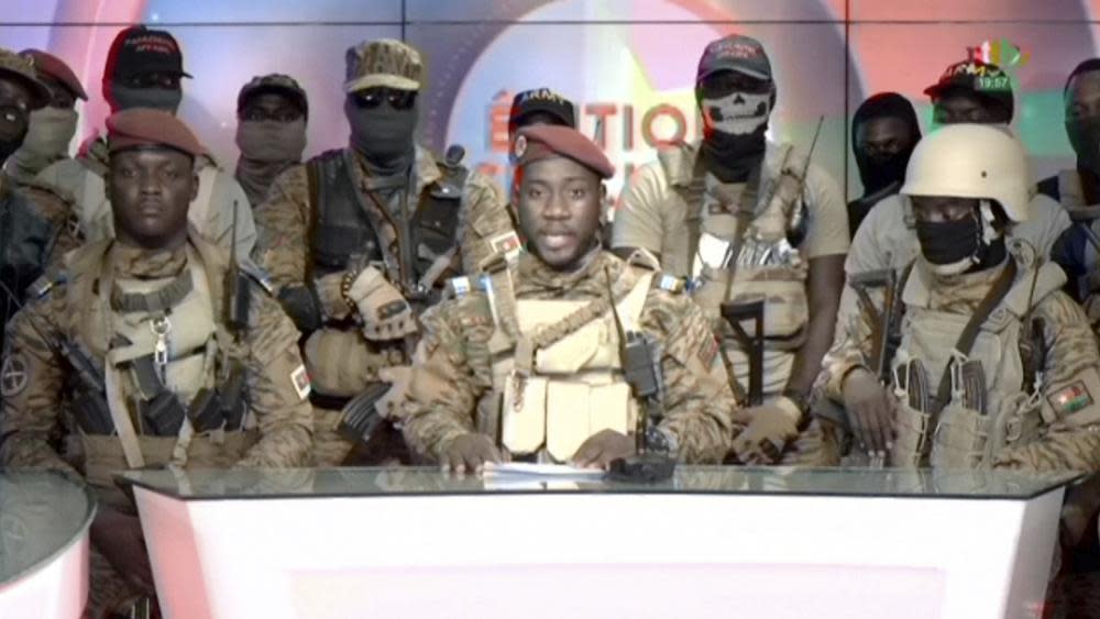 In this image from video broadcast by RTB state television, coup spokesman Capt. Kiswendsida Farouk Azaria Sorgho reads a statement in a studio in Ougadougou, Burkina Faso, on Friday evening, Sept. 30, 2022. Members of Burkina Faso’s army seized control of state television late Friday, declaring that the country’s coup leader-turned-president, Lt. Col. Paul Henri Sandaogo Damiba, had been overthrown after only nine months in power. The statement announced that Capt. Ibrahim Traore is the new military leader of Burkina Faso, a volatile West African country that is battling a mounting Islamic insurgency. (RTB via AP)