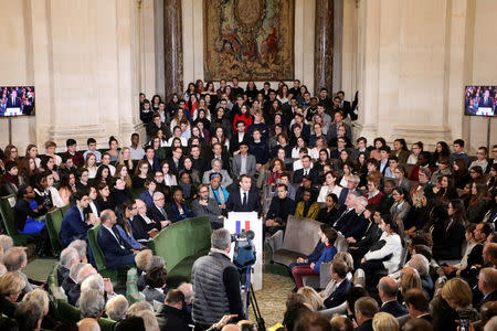 France's President Emmanuel Macron gives a speech to unveil his strategy to promote French language as part of the International Francophonie Day, before members of the French Academy and other guests, at the French Institute in Paris, France, March 20, 2018. Ludovic Marin/Pool via REUTERS