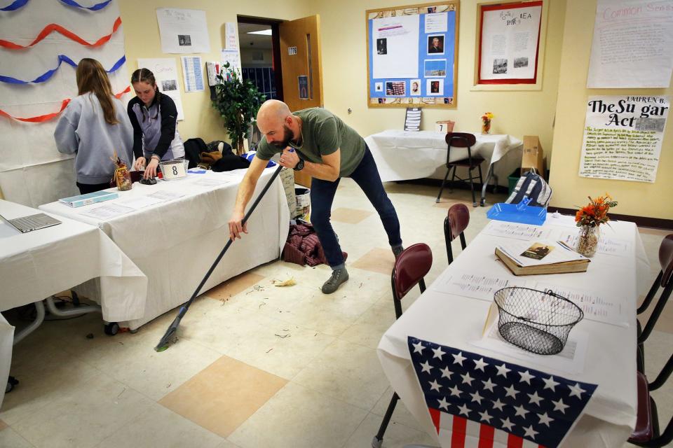 Middle School of the Kennebunks teacher Dan Sherman sweeps the floor at the Redcoats and Revolutions Grill and Tavern on Thursday, Feb 2.