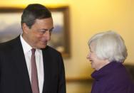 U.S. Federal Reserve Chair Janet Yellen (R) speaks with European Central Bank President Marlo Draghi at the Jackson Hole Economic Policy Symposium in Jackson Hole, Wyoming August 22, 2014. REUTERS/David Stubbs