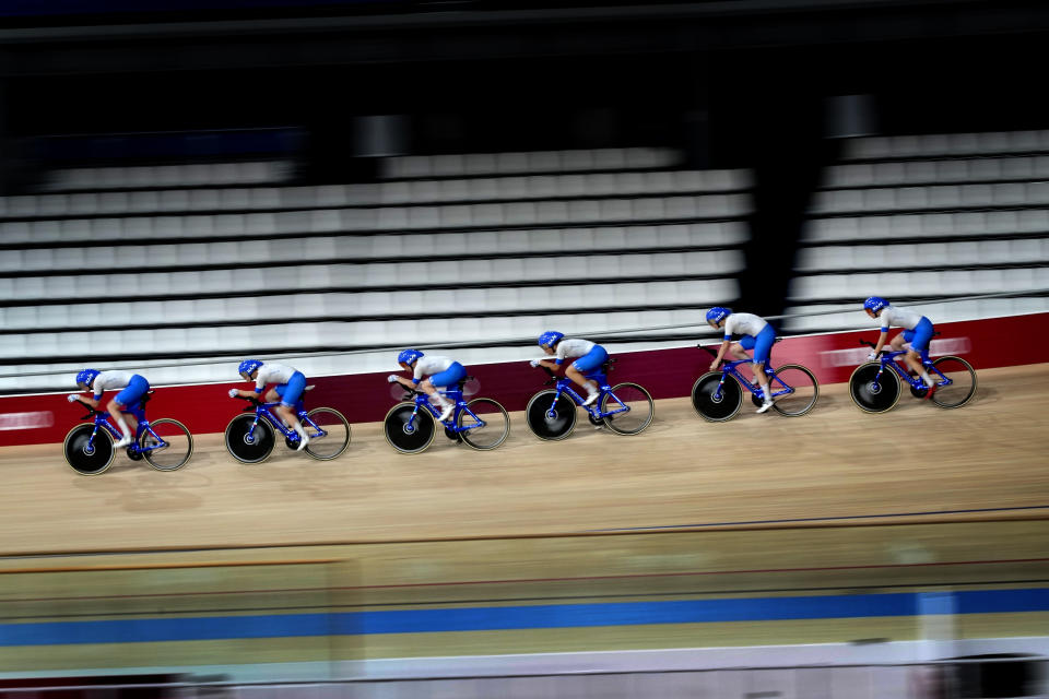 Members of the Italian men's track cycling team round the track during a training session inside the Izu velodrome at the 2020 Summer Olympics, Thursday, July 29, 2021, in Tokyo, Japan. (AP Photo/Christophe Ena)