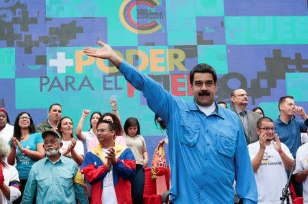 Venezuela's President Nicolas Maduro (C) waves as he arrives for an event with supporters in Caracas, Venezuela July 3, 2017. Miraflores Palace/Handout via REUTERS