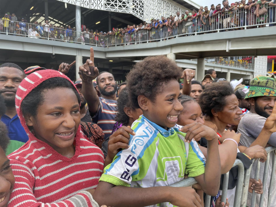 Hundreds of people gather to see New Zealand Prime Minister Chris Hipkins' visit at Gordon’s Market in Port Moresby, Papua New Guinea, Monday, May 22, 2023. Hipkins is due to meet with U.S. Secretary of State Antony Blinken in Papua New Guinea. (AP Photo/Nick Perry)