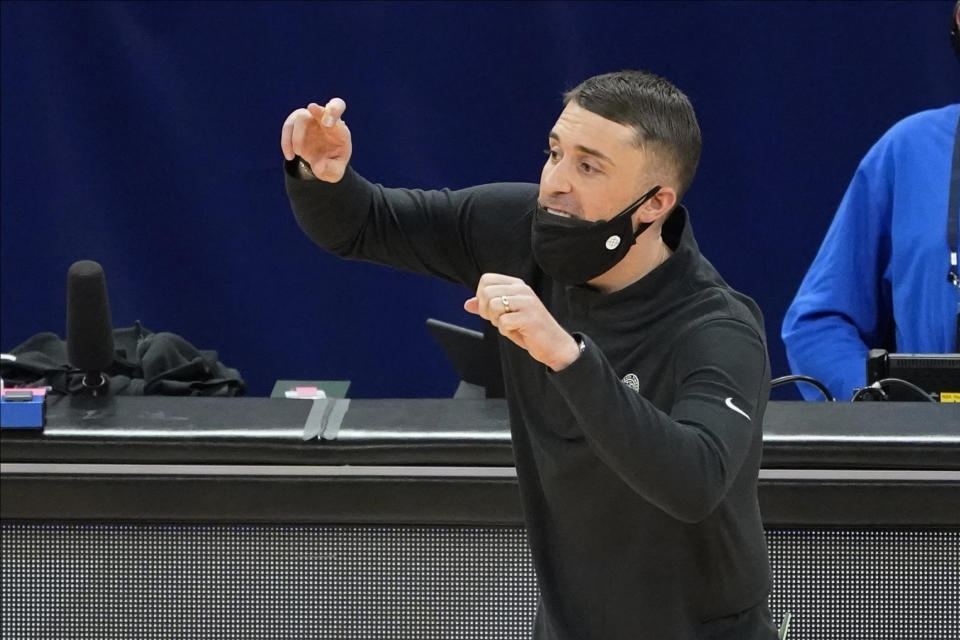 Minnesota Timberwolves coach Ryan Saunders gestures to players during the second half of the team's NBA basketball game against the Toronto Raptors, Friday, Feb. 19, 2021, in Minneapolis. (AP Photo/Jim Mone)