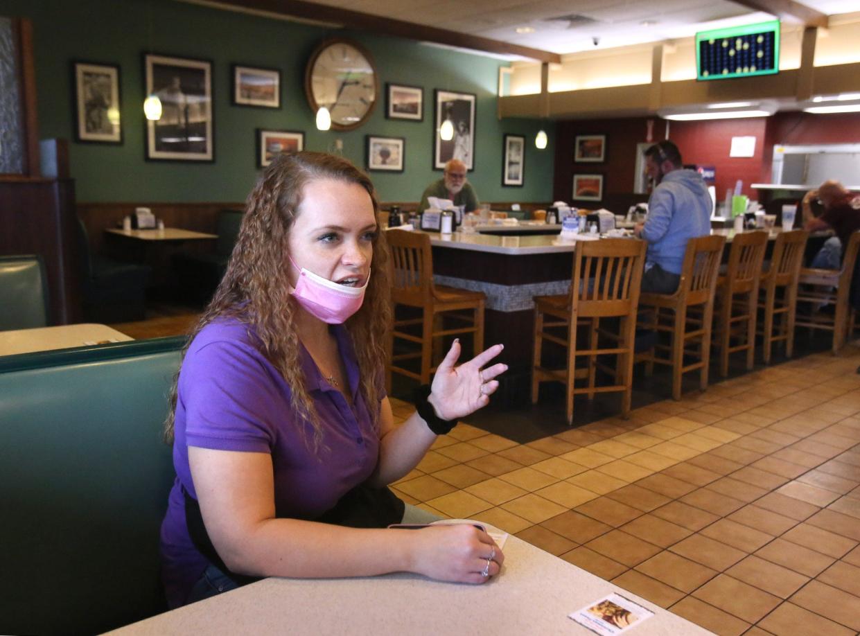 Erica Walker, a server with Country Pride Restaurant inside the TA Travel Center in Jackson Township, talks about being open for Christmas. Walker has worked there for 10 years.