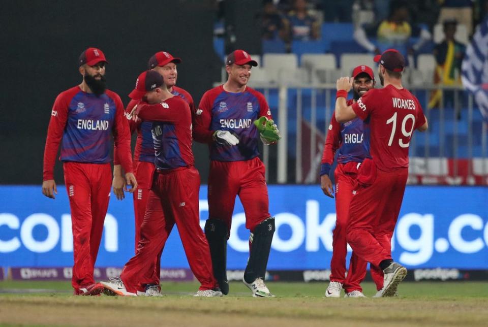 Jos Buttler, centre, brilliantly threw down the stumps of Dasun Shanaka to help England to victory (Aijaz Rahi/AP) (AP)