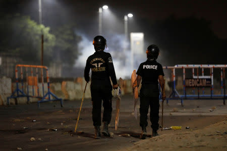 Police officers stand guard during a protest, after dispersing the supporters of the Tehrik-e-Labaik Pakistan Islamist political party, in Karachi, Pakistan November 24, 2018. REUTERS/Akhtar Soomro