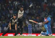 Cricket - New Zealand v India - World Twenty20 cricket tournament - Nagpur, India, 15/03/2016. New Zealand's wicketkeeper Luke Ronchi (C) and Ross Taylor (L) make successful LBW appeal against India's Shikhar Dhawan. REUTERS/Danish Siddiqui