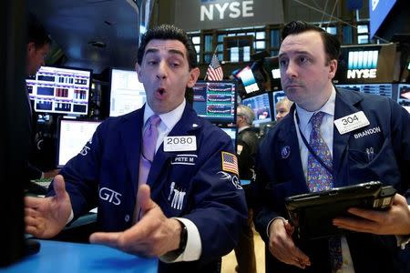 Traders work on the floor of the New York Stock Exchange (NYSE) in the Manhattan borough of New York, New York, U.S., April 4, 2017. REUTERS/Brendan McDermid