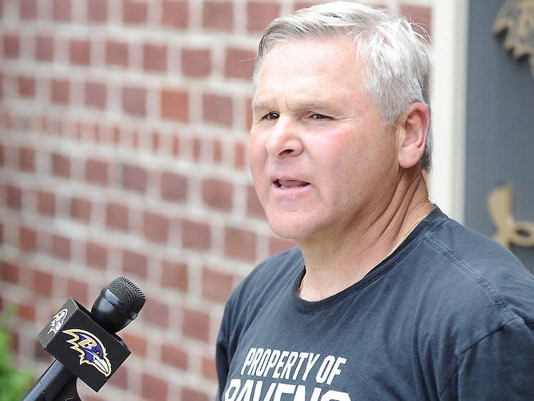 Baltimore Ravens offensive line coach Joe D'Alessandris speaks with reporters.