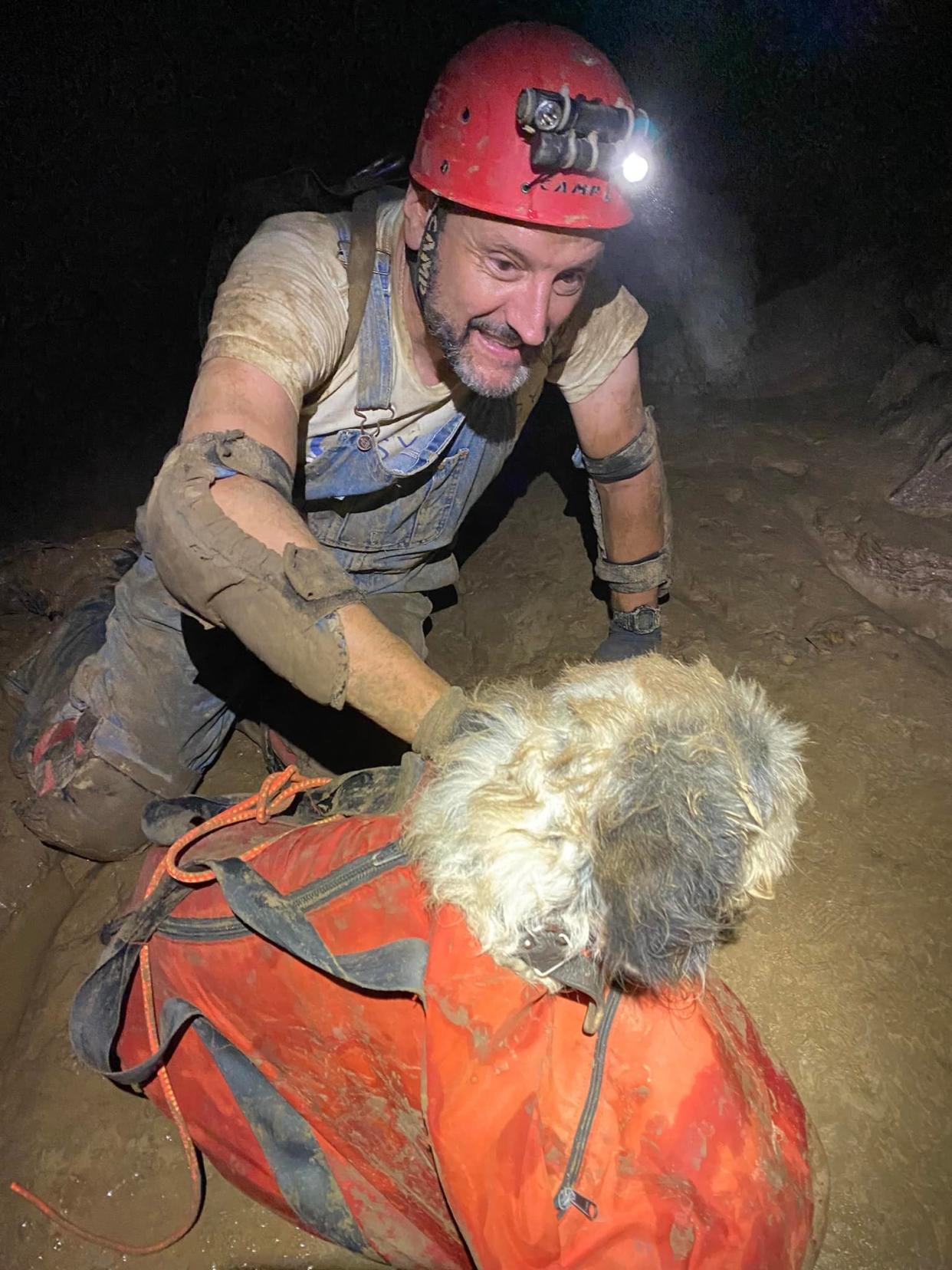 Gerry Keene rescues a dog that went missing in a cave north of Perryville, Missouri, Aug. 6, 2022.