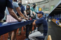 Tampa Bay Rays manager Kevin Cash takes part in a on-field news conference before a baseball game against the Washington Nationals Tuesday, June 8, 2021, in St. Petersburg, Fla. Reporters were allowed on the field before the game for the first time since 2019 due to the coronavirus restrictions being eased. (AP Photo/Chris O'Meara)