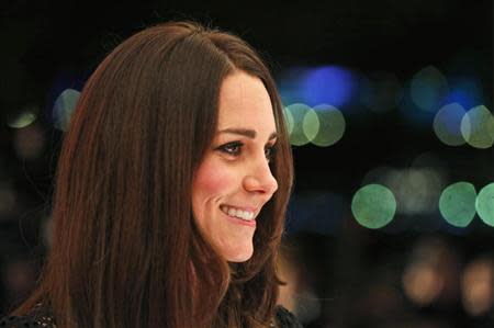 Britain's Catherine, Duchess of Cambridge, patron of SportsAid charity, smiles as she meets youth athletes during the charity's annual gala dinner SportsBall in London, November 28, 2013. REUTERS/Lefteris Pitarakis/Pool